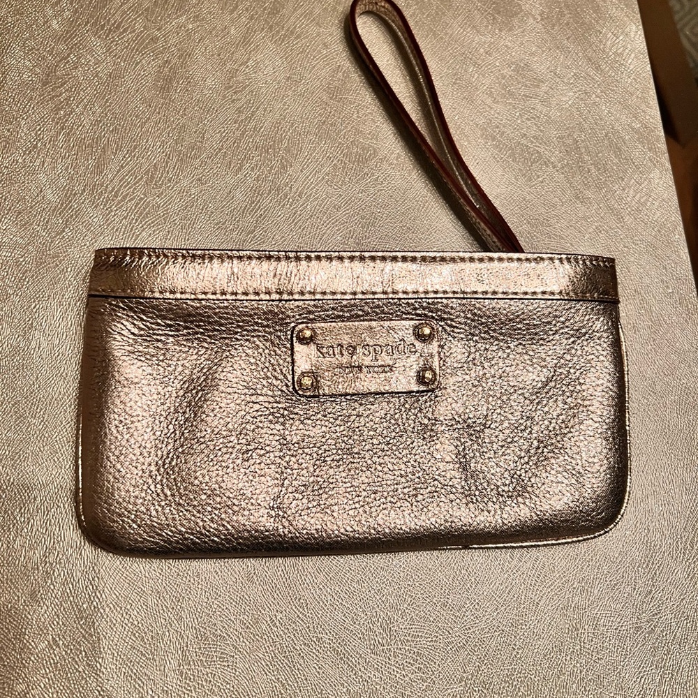 KATE SPADE Gold Metallic Clutch Wristlet 8" x 4". ZIP close. NWOT Pink lining.